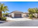 Attractive single-story home showcases a tile roof, a two-car garage, and desert-style landscaping at 7286 Mount Kearsarge St, Las Vegas, NV 89131