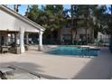 Sparkling community pool surrounded by ample seating and mature trees and shrubs at 7450 S Eastern Ave # 1012, Las Vegas, NV 89123