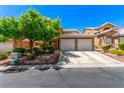 Inviting two-story home with a two-car garage, mature trees, and easy to maintain xeriscape at 8041 Astrology Ct # 201, Las Vegas, NV 89128