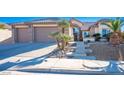 Lovely front exterior featuring a well-maintained lawn and a three-car garage at 816 Sandsprings St, Henderson, NV 89011