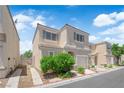 Charming two-story home with stucco exterior, manicured landscaping, and attached one car garage at 9957 Fine Fern St, Las Vegas, NV 89183