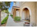 Townhouse entrance featuring an arched entryway and tiled patio at 9975 Peace Way # 1024, Las Vegas, NV 89147