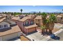 An aerial view showcases the home's location within a quiet neighborhood and nearby community at 1711 Ember Glow Cir, Las Vegas, NV 89119