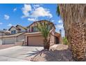 A charming home with a two-car garage and easy to maintain desert landscaping at 1711 Ember Glow Cir, Las Vegas, NV 89119