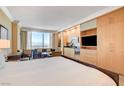 Stylish bedroom with a kitchenette and a seating area, offering a comfortable and convenient living space at 2000 N Fashion Show Dr # 4015, Las Vegas, NV 89109