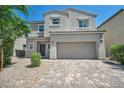 Charming two-story home with a two-car garage and desert landscaping at 2024 Mystic Wave Rd, North Las Vegas, NV 89031