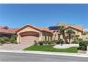 Charming one-story home with desert landscaping, artificial lawn, and a two-car garage with brick paver driveway at 2605 Orchid Valley Dr, Las Vegas, NV 89134
