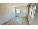 Neutral bedroom with tiled floors and natural light from windows at 4238 Boratko St, Las Vegas, NV 89115