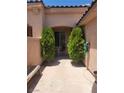 Inviting courtyard featuring a cozy seating area and mature landscaping at 5389 Progresso St, Las Vegas, NV 89135