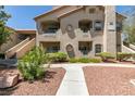 This condo building features an attractive facade, balconies, and well-maintained landscaping at 5415 W Harmon Ave # 2075, Las Vegas, NV 89103