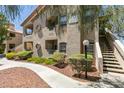 Beautifully landscaped condo with private balconies and well-maintained exterior stairway at 5415 W Harmon Ave # 2075, Las Vegas, NV 89103