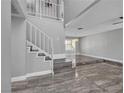 Bright entryway featuring a staircase, marble floors, and neutral colors leading to a living space at 6628 Celeste Ave, Las Vegas, NV 89107