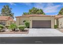 Charming home featuring a two-car garage, mature landscaping, and tile roof at 7909 Canoe Ln, Las Vegas, NV 89145