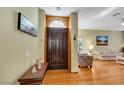 Home foyer with beautiful hardwood floors, decorative door and nice decor at 7909 Canoe Ln, Las Vegas, NV 89145