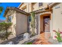 Inviting front porch with stone accents and tiled walkway leading to the front door at 8026 Sunset Creek St, Las Vegas, NV 89113