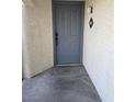 Exterior shot of a gray front door with modern hardware and the unit number displayed at 8455 W Sahara Ave # 258, Las Vegas, NV 89117