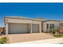 Attractive single-story home with a two-car garage and well-maintained desert landscaping at 8934 Windgate Ranch St, Las Vegas, NV 89166