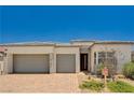 Charming single-story home features a two-car garage, desert landscaping, and modern design at 8934 Windgate Ranch St, Las Vegas, NV 89166