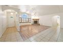 Inviting living room featuring tile and wood floors and a stone fireplace at 901 E Jaybird St, Pahrump, NV 89048
