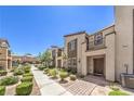 Well-maintained townhome exteriors with sidewalks, landscaping, and private front entries at 1197 Mission View Ct, Henderson, NV 89002