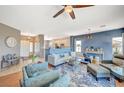 Comfortable living room with hardwood floors, modern furnishings, and an open layout at 1466 Fieldbrook St, Henderson, NV 89052