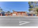 Suburban single Gathering home with gated yard and mature trees at 1818 Waldman Ave, Las Vegas, NV 89102