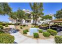 Inviting condo complex with mature trees, covered parking, and manicured landscaping at 2325 Windmill Pkwy # 1622, Henderson, NV 89074