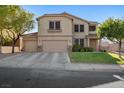Charming two-story home featuring a three-car garage and well-manicured front lawn at 249 Cinnamon Ridge Way, Henderson, NV 89015