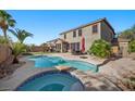Backyard features a refreshing pool and spa area, perfect for outdoor relaxation and entertainment at 249 Cinnamon Ridge Way, Henderson, NV 89015