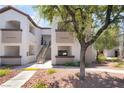 Charming condo building featuring a well-kept exterior, stair access, and lovely tree-lined surroundings at 2615 W Gary Ave # 1053, Las Vegas, NV 89123