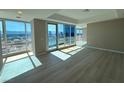 Bright living area with floor-to-ceiling windows and scenic city views, filled with natural light at 4525 Dean Martin Dr # 2704, Las Vegas, NV 89103