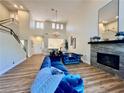 Bright living room with fireplace, high ceilings, and modern finishes at 4963 Crooked Stick Way, Las Vegas, NV 89113