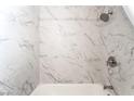 Bathroom showcasing a shower with marble-look tiles and a modern shower head and hardware at 600 Berry Cir, Las Vegas, NV 89107