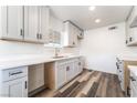 Bright kitchen featuring modern cabinets, quartz countertops, and stainless steel sink with dark hardware at 600 Berry Cir, Las Vegas, NV 89107