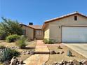 Charming single-story home featuring a rockscaped front yard with drought tolerant landscaping and a two-car garage at 6357 Cobalt Ln, Las Vegas, NV 89146