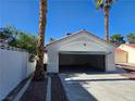 Attached garage with automatic door, providing convenient parking and extra storage space at 6636 Old Oxford Ave, Las Vegas, NV 89108