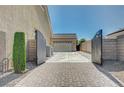 View of gated driveway leading to the three car garage at 6971 Moaning Cavern St, Las Vegas, NV 89131