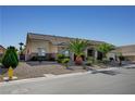 Single story home with low maintenance desert landscaping, stone accents and three car garage at 6971 Moaning Cavern St, Las Vegas, NV 89131