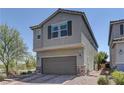 Charming two-story home featuring a two-car garage and brick-paved driveway at 7705 Alder Forest St, Las Vegas, NV 89113