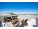 Rooftop terrace with stylish outdoor furniture and panoramic city views on a clear day at 9314 Hopcroft Ave, Las Vegas, NV 89178
