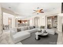 Bright living room featuring an open layout, modern furniture, and stylish decor at 10348 Hawks Wing St, Las Vegas, NV 89178