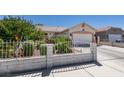Single-story home with well-manicured front yard and attached two-car garage at 1110 Orchard Valley Dr, Las Vegas, NV 89142