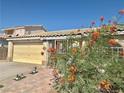 Close up of home featuring desert landscaping and a front gate at 1461 Harmony Hill Dr, Henderson, NV 89014