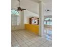 Bright living room with tile flooring, high ceilings, and natural light at 1461 Harmony Hill Dr, Henderson, NV 89014