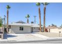 Well-maintained single-story home with desert landscaping and long driveway at 2005 Jansen Ave, Las Vegas, NV 89101