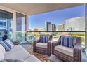 Relaxing outdoor balcony with comfortable seating and panoramic views of the city skyline at 4575 Dean Martin Dr # 1112, Las Vegas, NV 89103