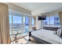 Serene main bedroom with large windows offering breathtaking city views and ample natural light at 4575 Dean Martin Dr # 1112, Las Vegas, NV 89103