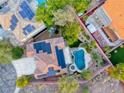 Aerial view of the property showcasing the pool, jacuzzi, solar panels, and landscaped backyard at 53 Precipice Ct, Henderson, NV 89002