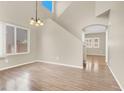 Bright and airy living room with hardwood floors, and neutral wall colors, perfect for relaxation at 636 Pacific Cascades Dr, Henderson, NV 89012