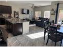 Bright living and dining area with an open view to the kitchen and a comfortable seating arrangement at 6867 Dragonfly Rock St, Las Vegas, NV 89148